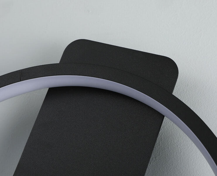 Modern, minimalistisk, klockformad LED-vägglampa med 1 ljus