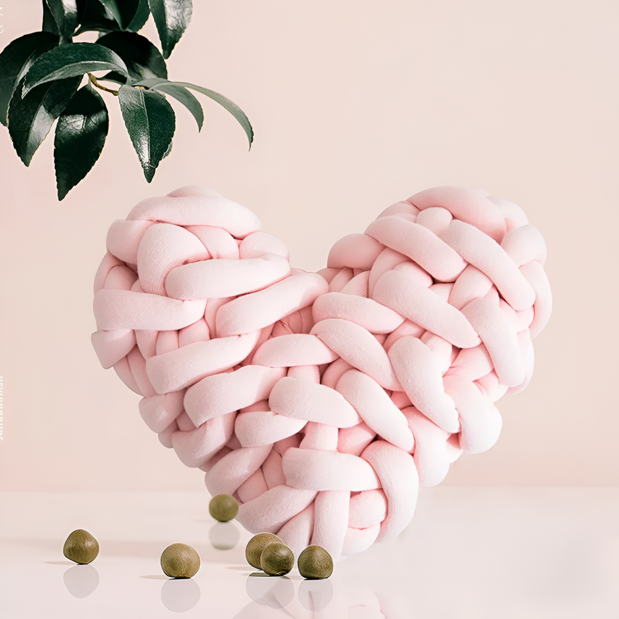 Plush knotted heart-shaped cushions