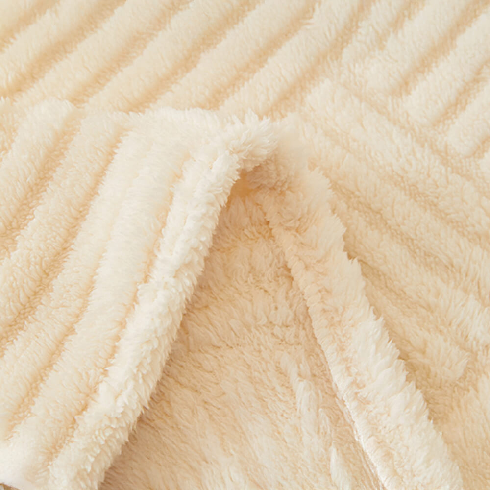 Oregelbundet rutigt randigt puffade sammetsoffatäcke