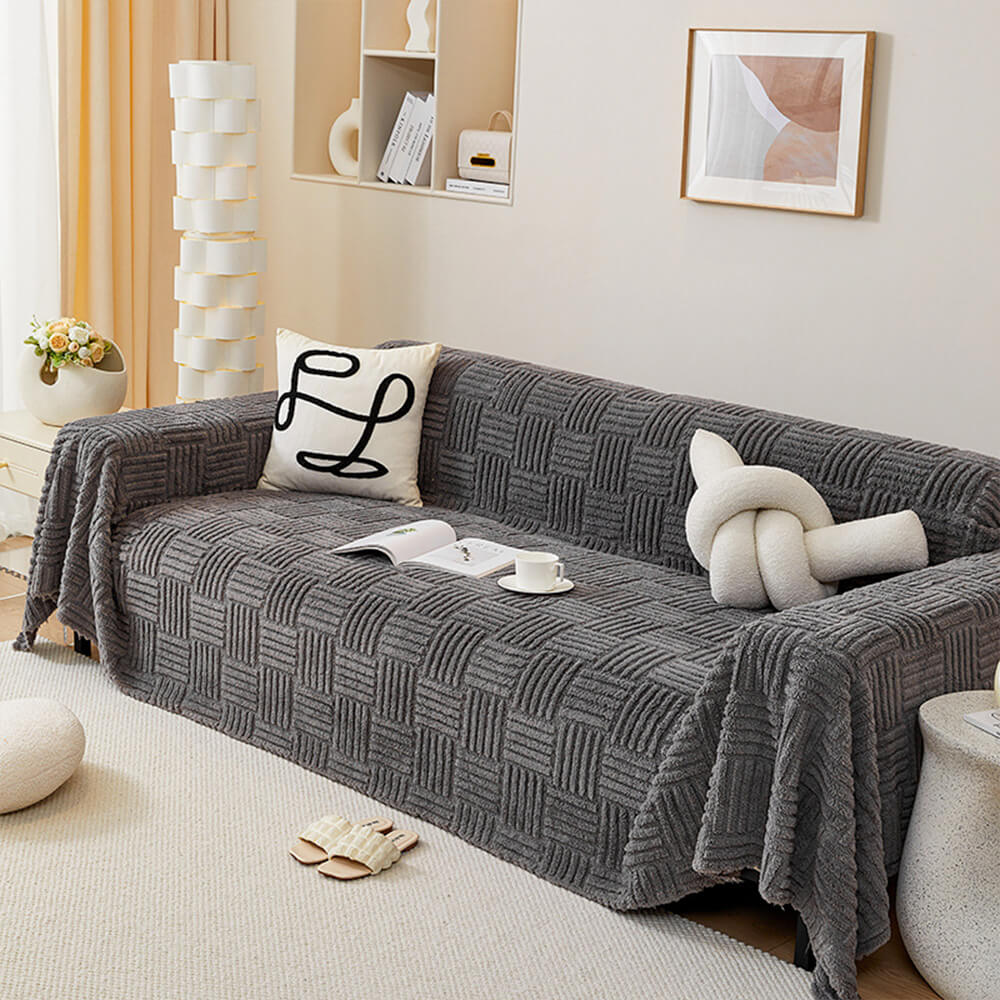 Oregelbundet rutigt randigt puffade sammetsoffatäcke