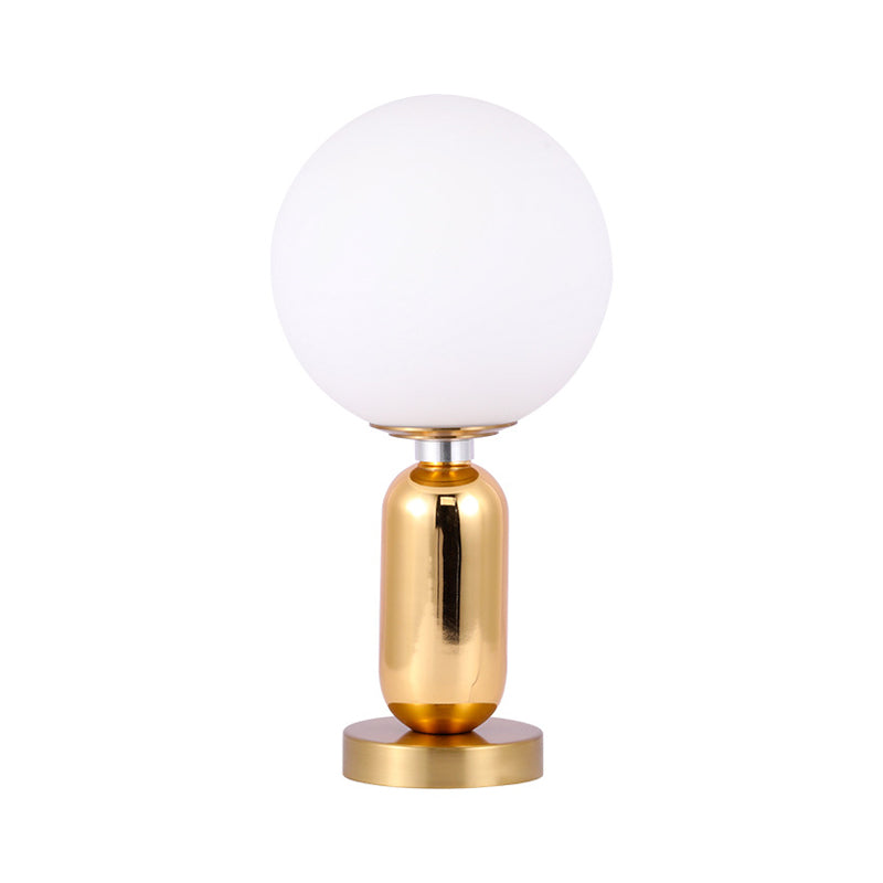 GloBelle - Modern glasklotformad lampa med gyllene metallfot