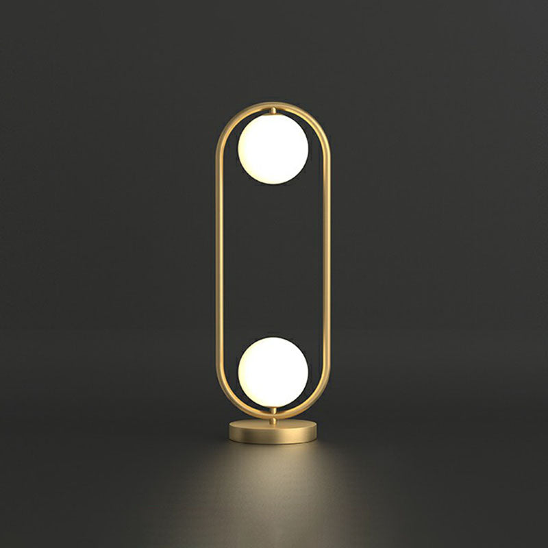 Bordslampa med 2 kulor - Guldfinish med glasöverdrag och oval ram