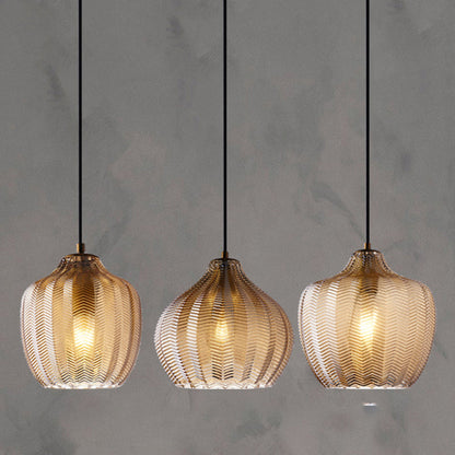Modern glas hänglampa med vågformad skugga för matrum
