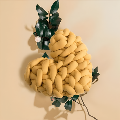 Plush knotted heart-shaped cushions