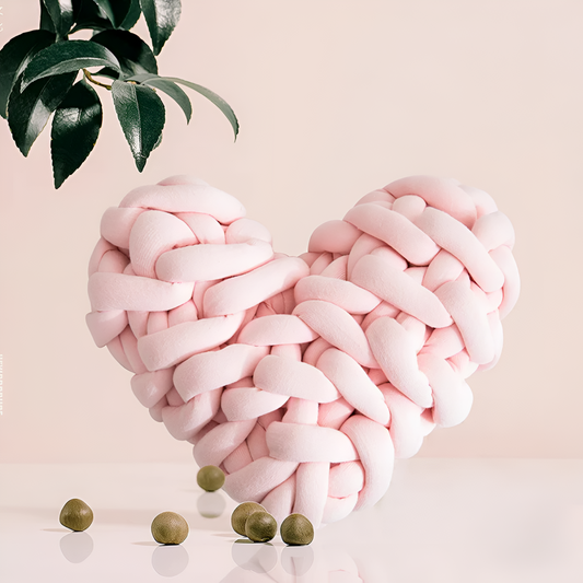 Plush knotted heart-shaped cushions