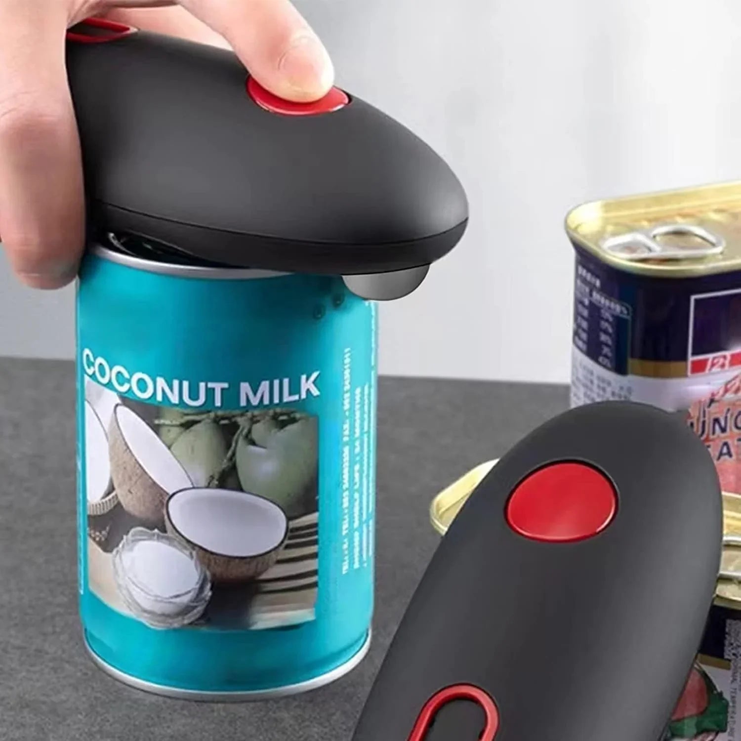 Automatisk burköppnare med ergonomiskt handtag och en-knapps betjening