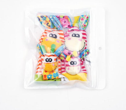 Sensoriska babyplyschstrumpor och handledsband