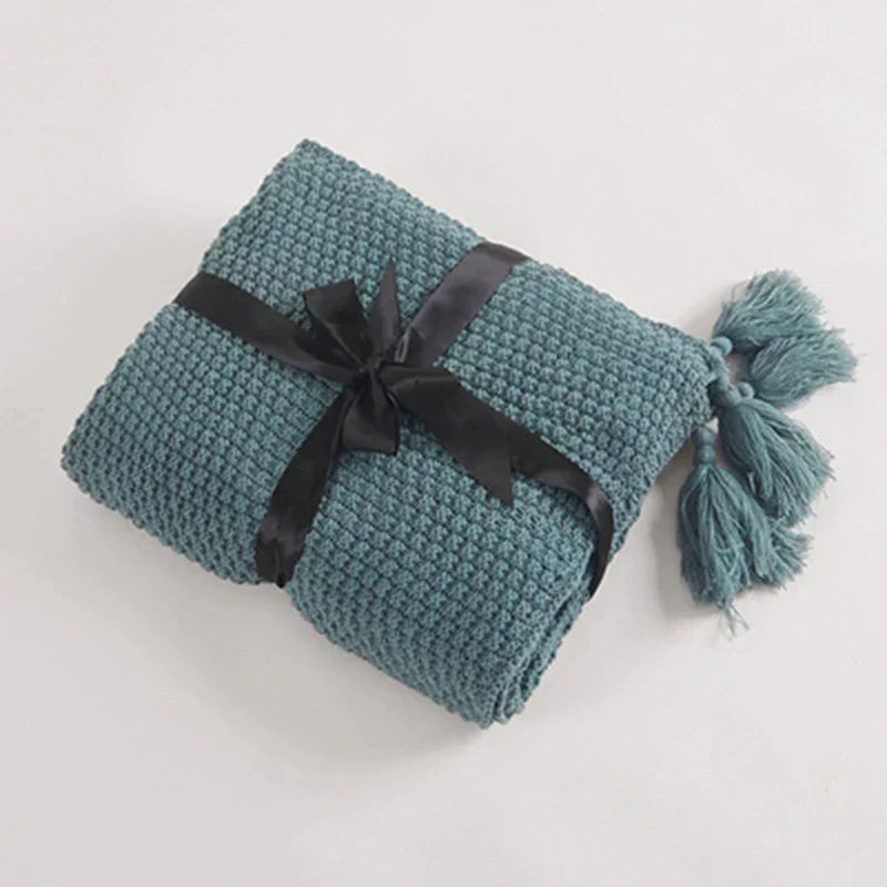 Stickad ullfilt med fransar