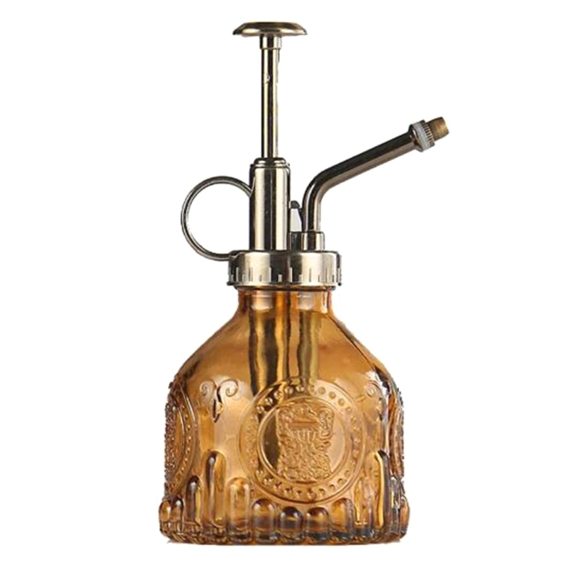 Präglad glasflaska med metallmunstycke – växtspruta för blommabesträckning i vintage-design