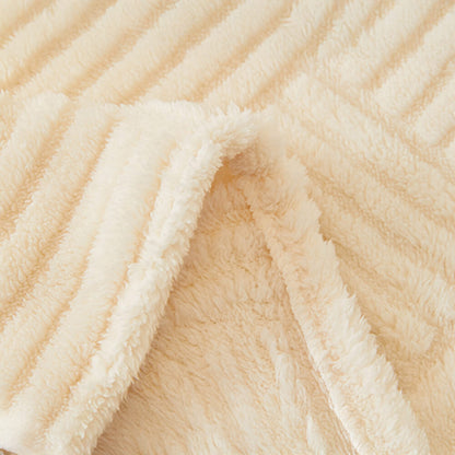 Oregelbundet rutigt randigt puffade sammetsoffatäcke