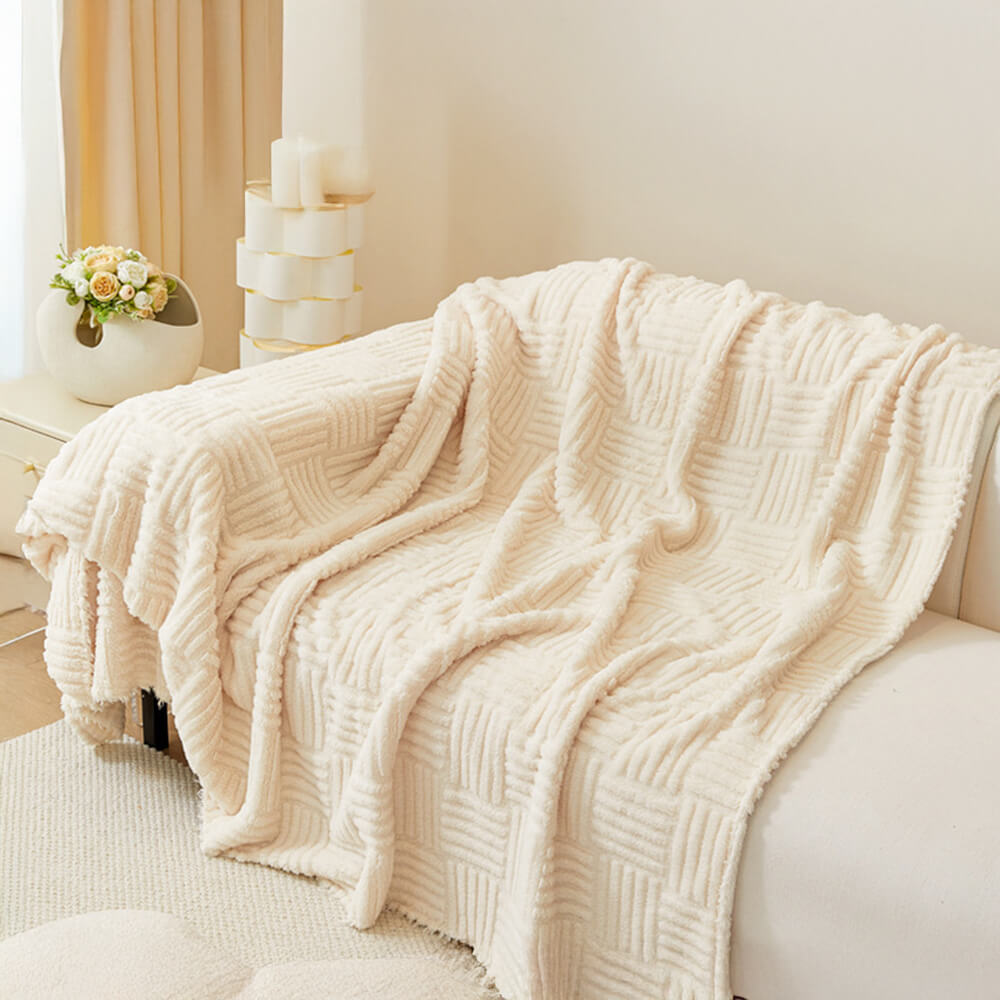 Oregelbundet rutigt randigt puffade sammetsoffatäcke