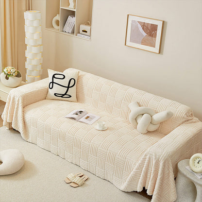 Oregelbundet rutigt randigt puffade sammetsoffatäcke