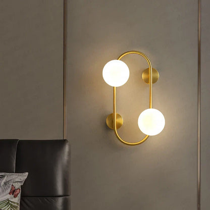 LuminoSphere - Modern mässingsvägglampa med glasbollar