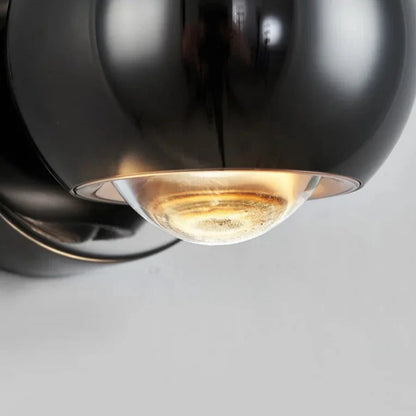 Orbis LED-vägglampa – Rotabel kulformad lampa i svart med 360° ljusriktning