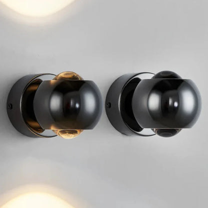 Orbis LED-vägglampa – Rotabel kulformad lampa i svart med 360° ljusriktning