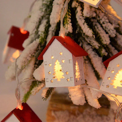 Träjuletidshus med LED-belysning för festlig dekoration