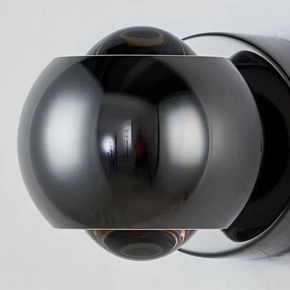 Orbis LED-vägglampa – Rotabel kulformad lampa i svart med 360° ljusriktning