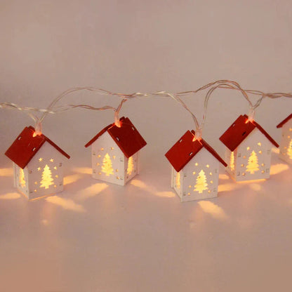 Träjuletidshus med LED-belysning för festlig dekoration