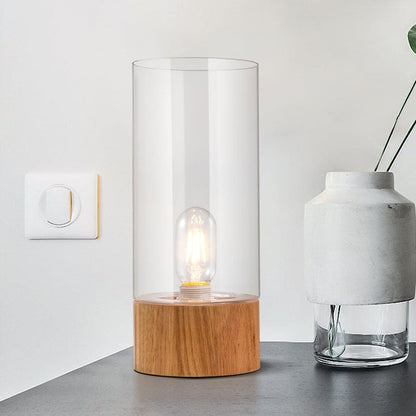 Elegant cylindrisk bordslampa med träbas för mysiga interiörer