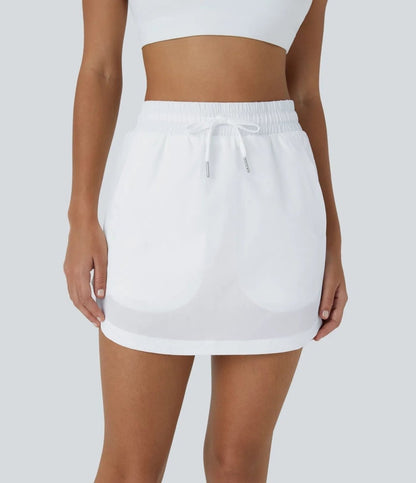 GOLFGLIDE Kjol - Mini med korta byxor, dragsko och dolda fickor