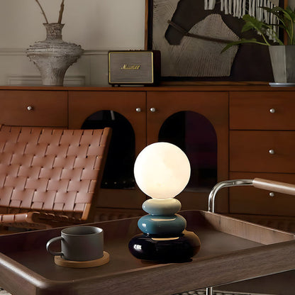 PebbleAura - Elegant småstensformad sänglampa med mjukt LED-ljus och modern design