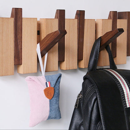 Pianohang - Platsbesparande vägggarderob med vikbara krokar i pianodesign