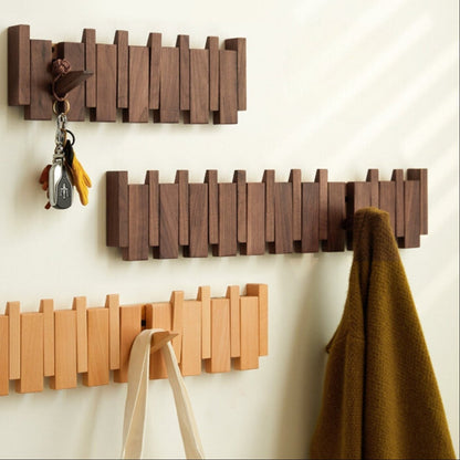 Pianohang - Platsbesparande vägggarderob med vikbara krokar i pianodesign